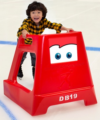A kid ice skating with handrails
