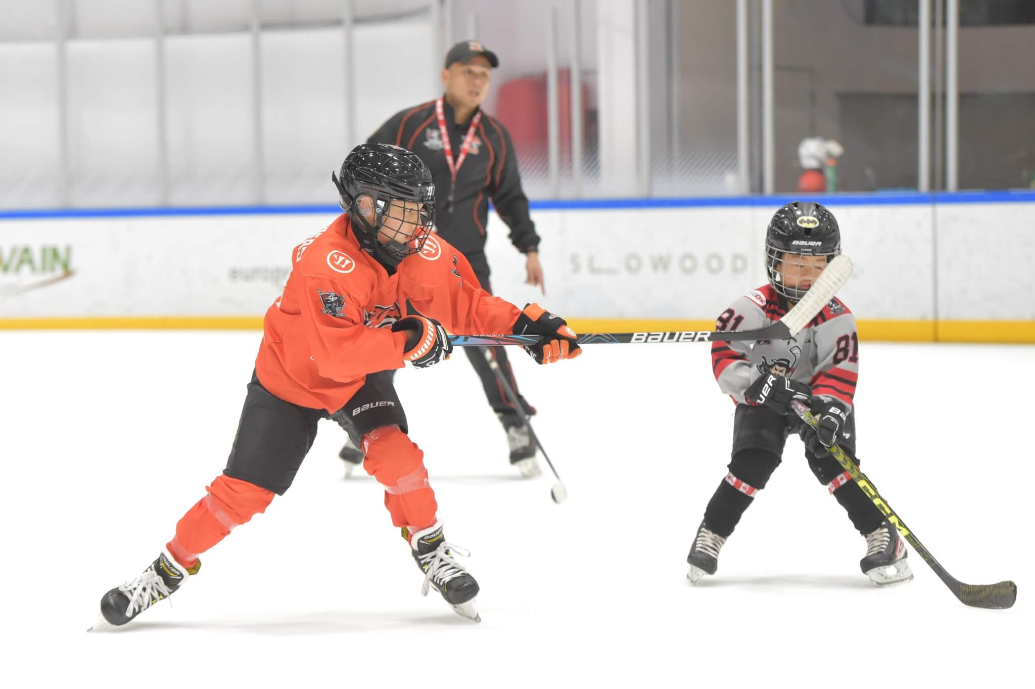 Kids learning to play hockey