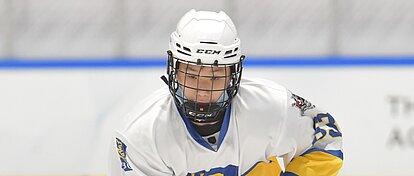 A young hockey player in full gear