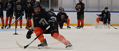 A hockey player making a pass
